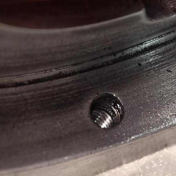 foreign-material-inside-threaded-hole-of-buffer-assembly